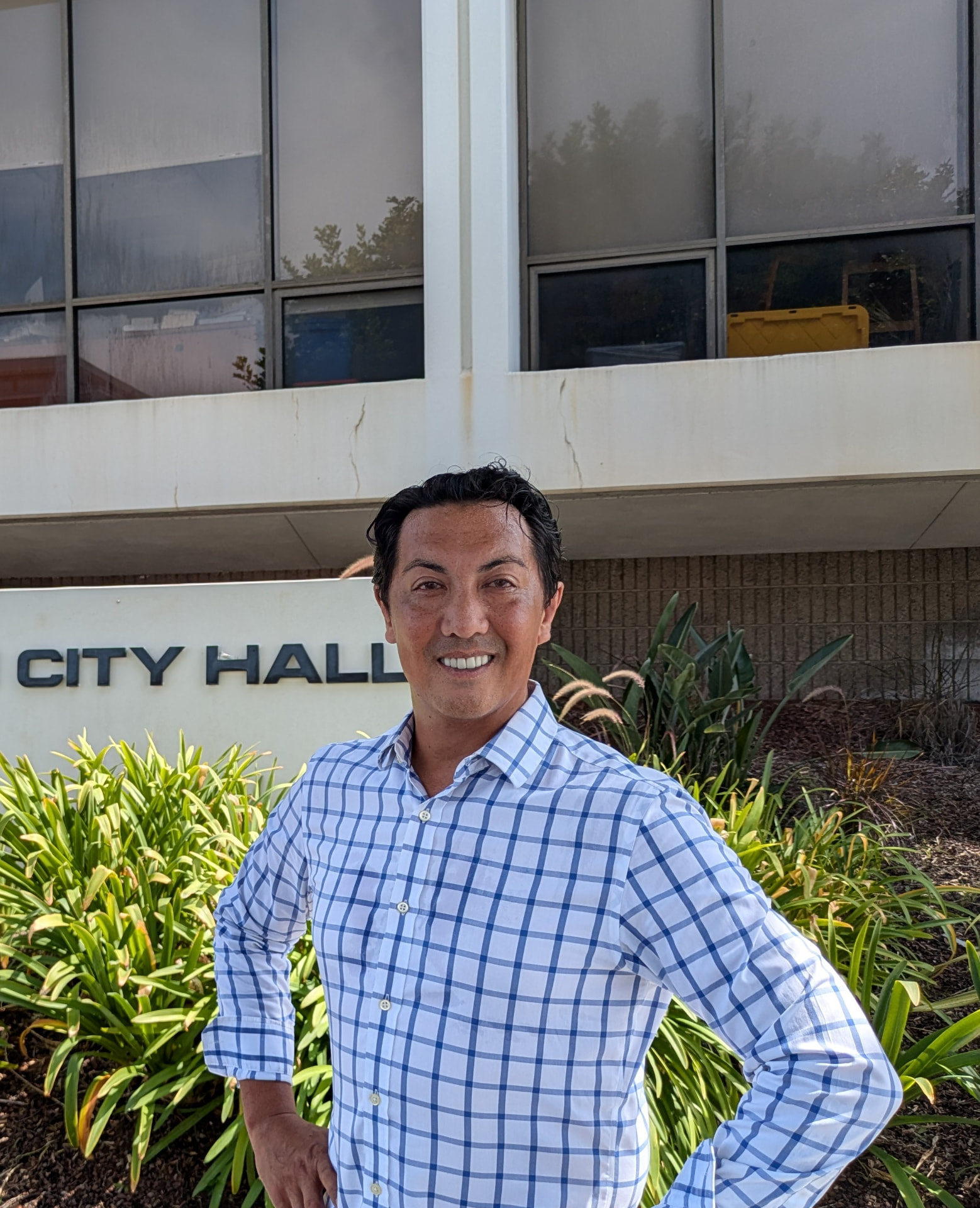 Joseph Ungoco standing outside Manhattan Beach City Hall